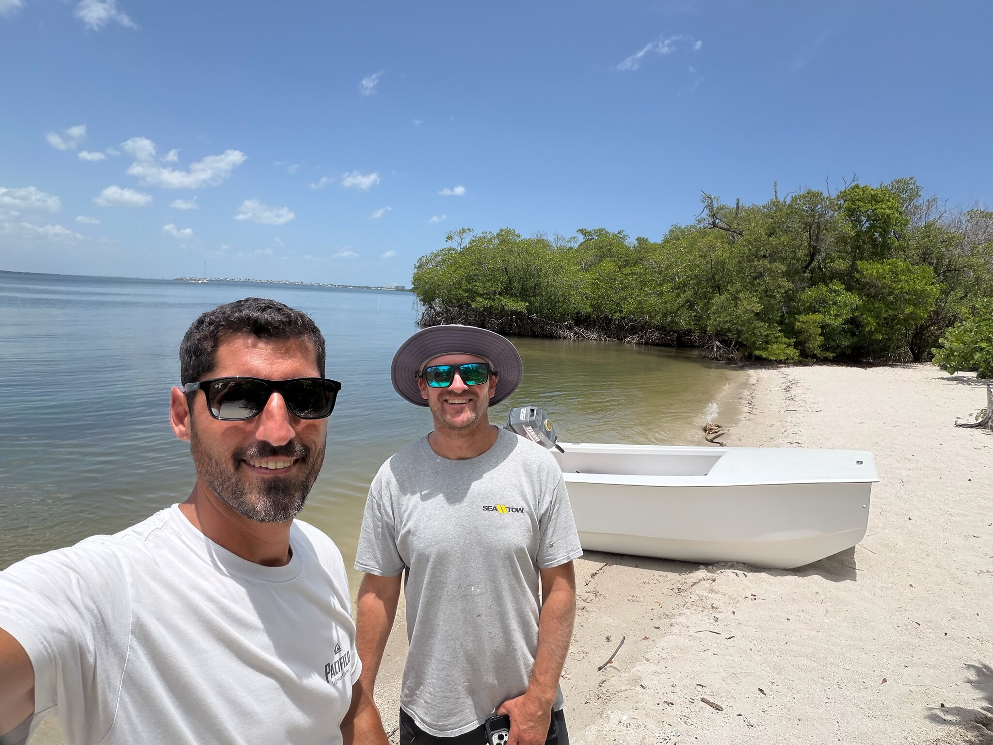 Cape Catamarans co-owners Andrew Hodgdon and Mike Rybas on a Florida sandbar with the Cape Cat 115
