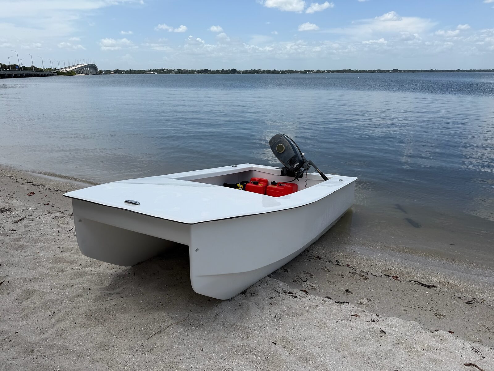 Cape Cat 115 beached, three-quarter view