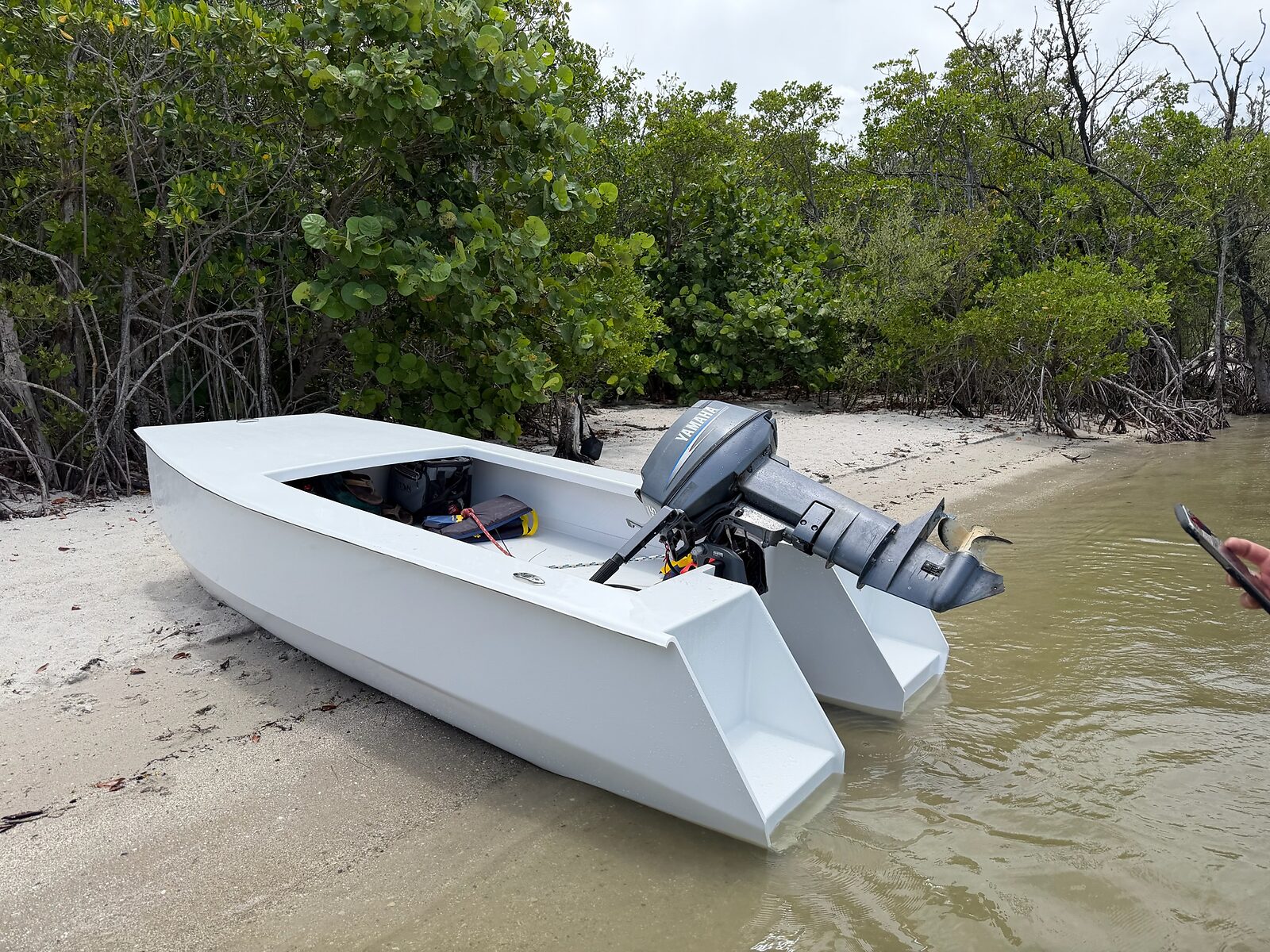 Cape Cat 115 beached broadside