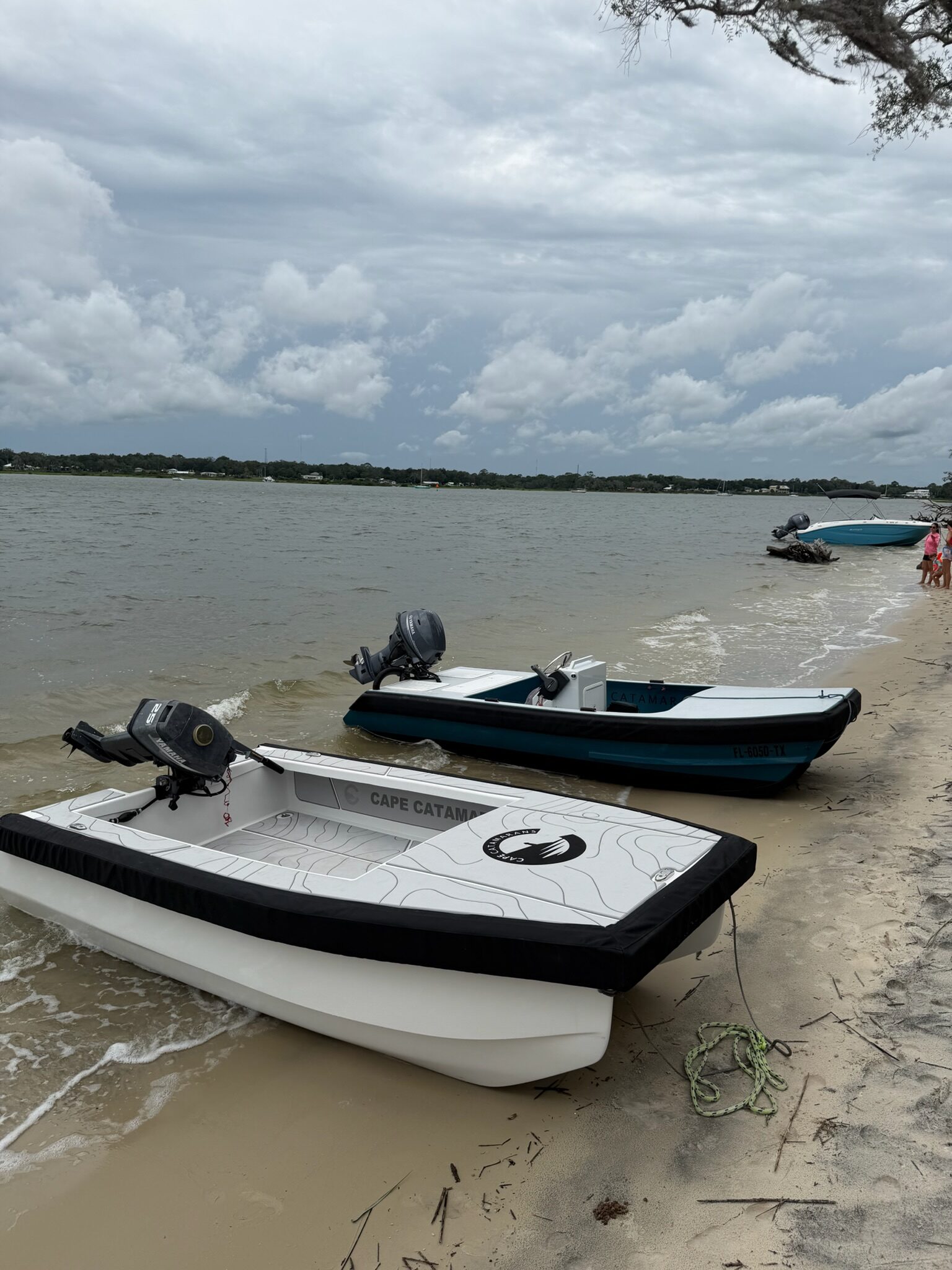 Two Cape Cats beached side by side