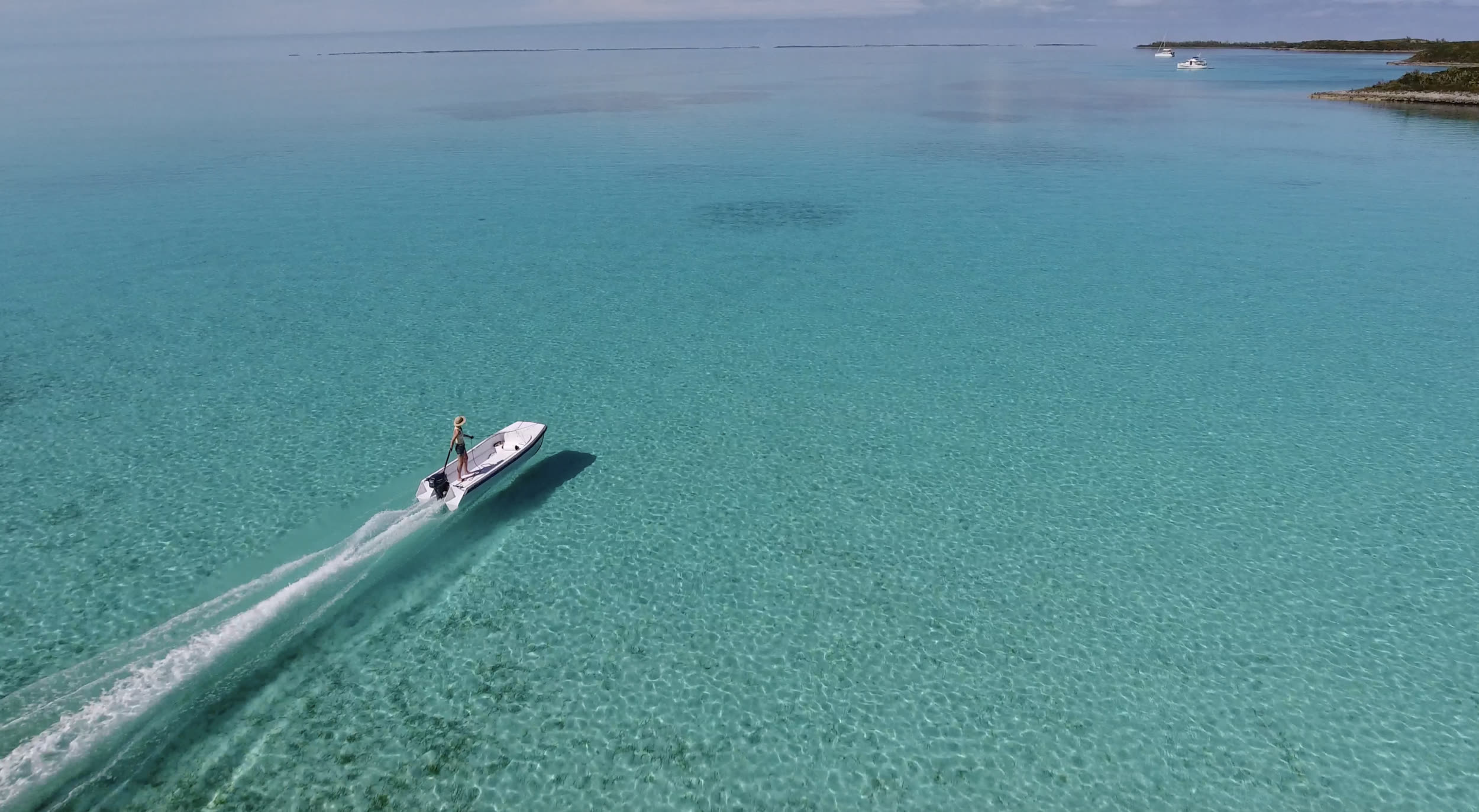 Cape Cat cruising over shallow turquoise flats