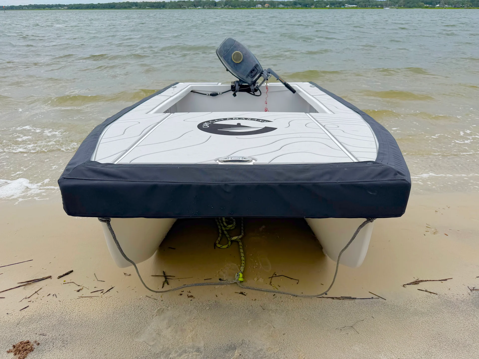 Cape Cat 115 bow-on, beached on a sandbar