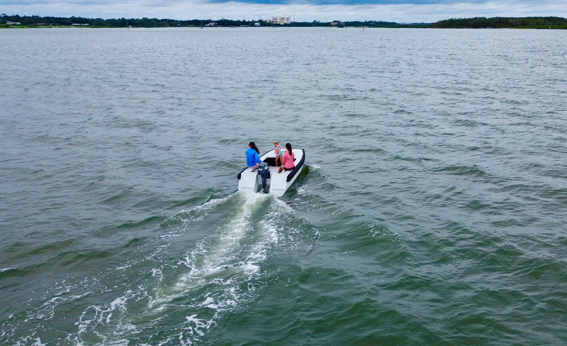 Cape Cat 115 running out across the bay toward the causeway